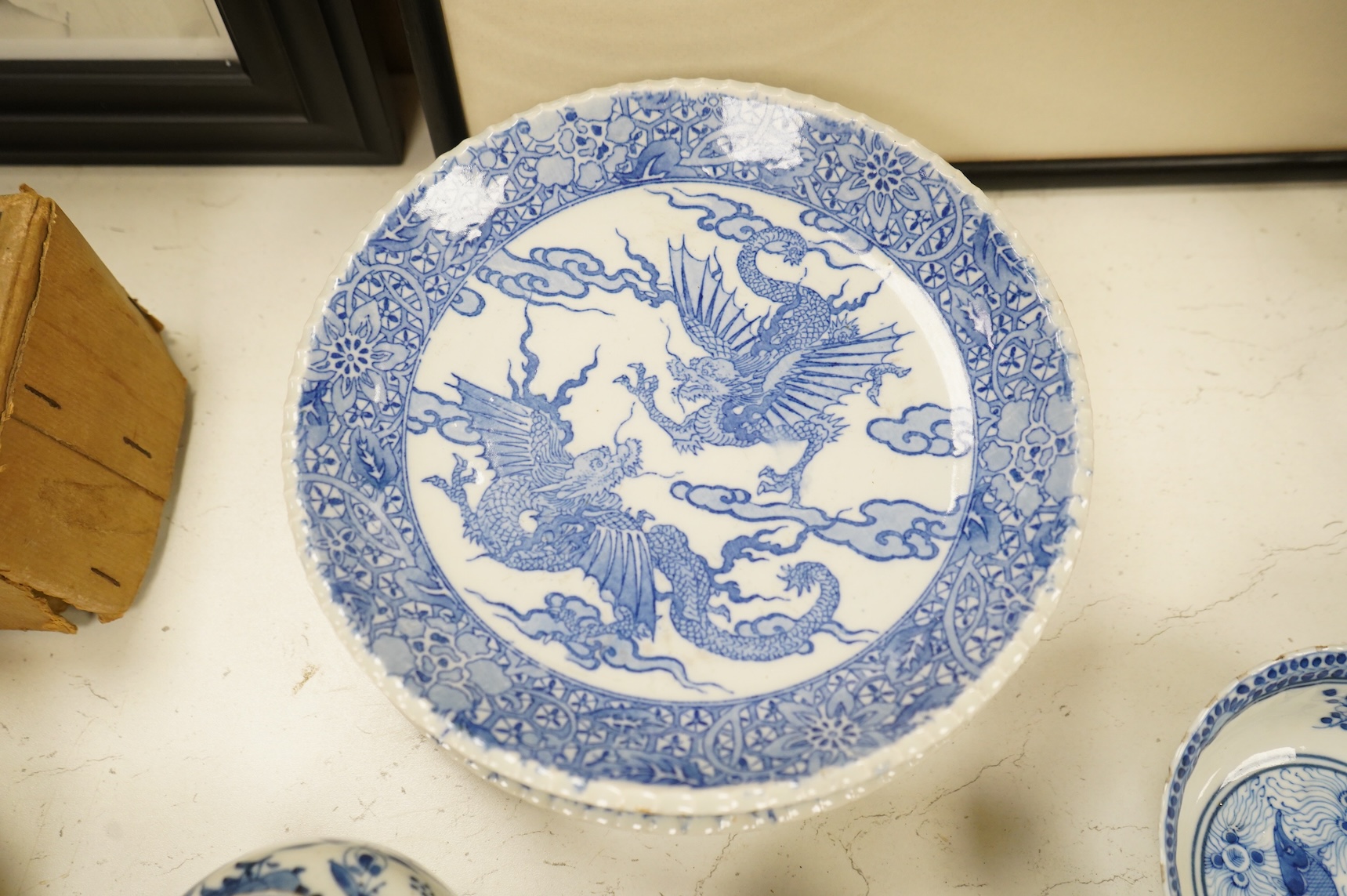 Group of blue and white Chinese porcelain and pottery to include dragon dishes and a pair of fish bowls, together with a pair of tin glazed vases, largest 21cm in diameter